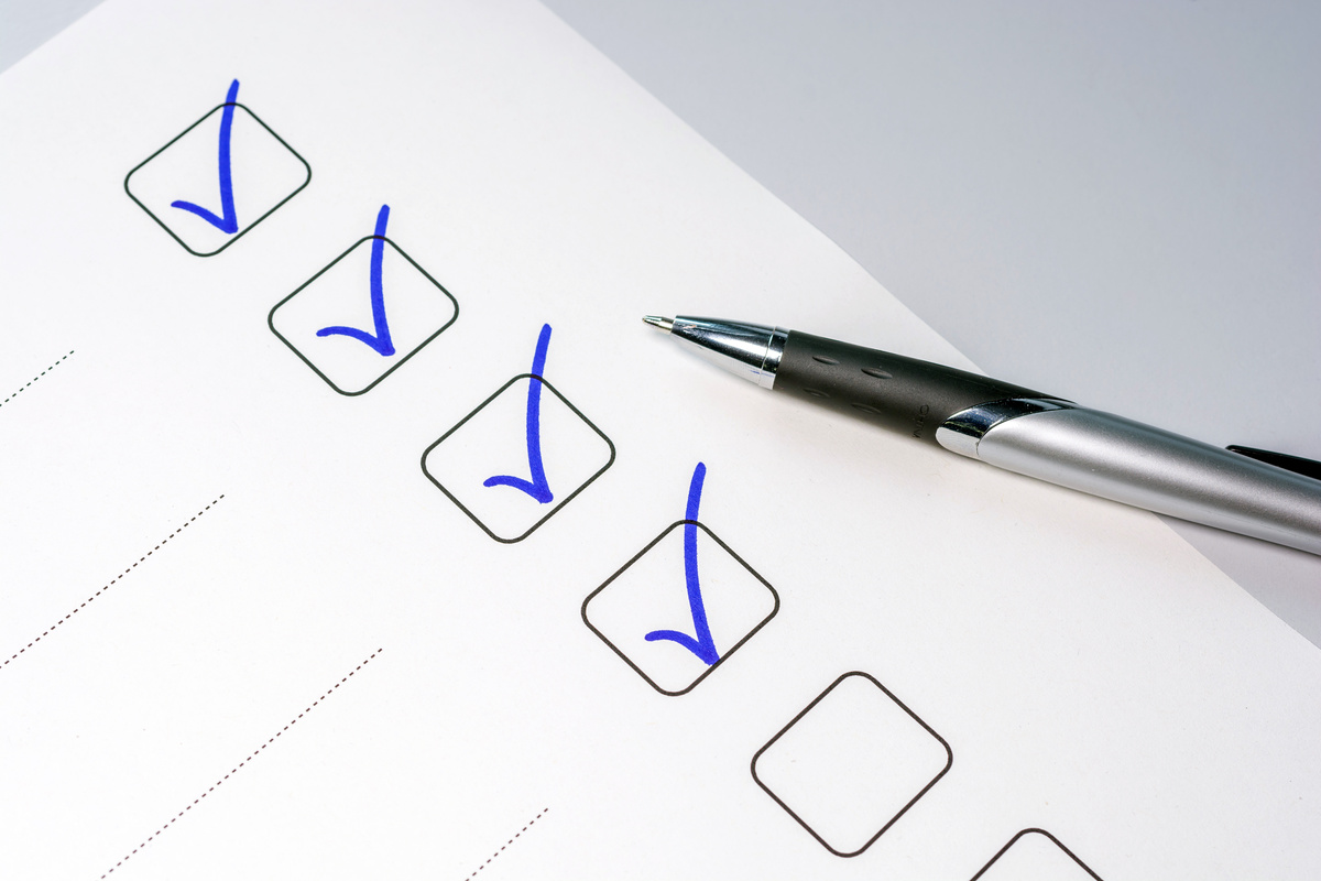 Exhaust pipes checklist on a table as a background